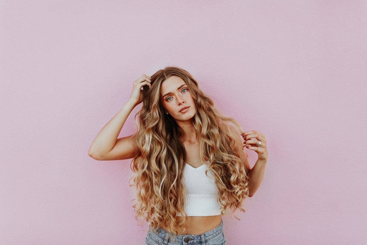 photo of young woman with long blonde hair