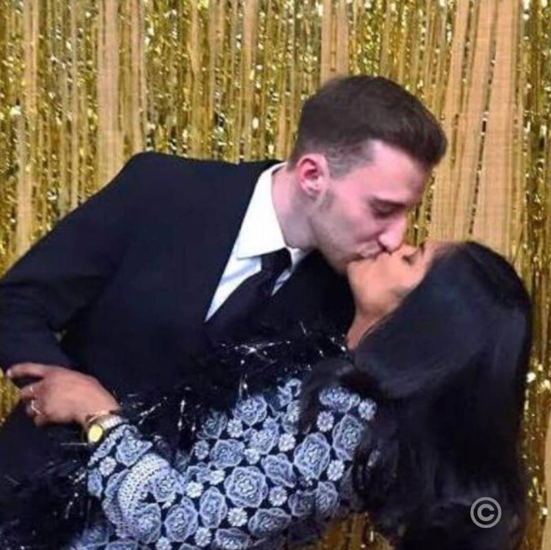 The couple kissing