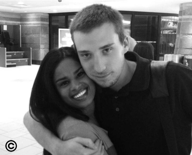 couples hugging at the mall