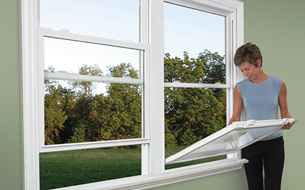 Woman cleaning windows