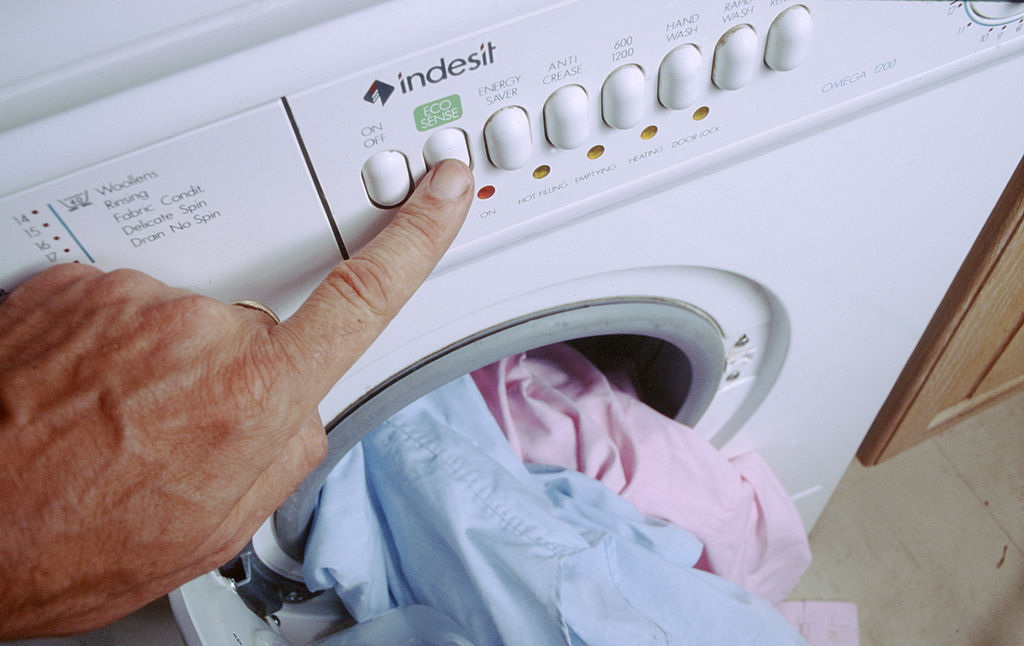 Person turning on washing machine