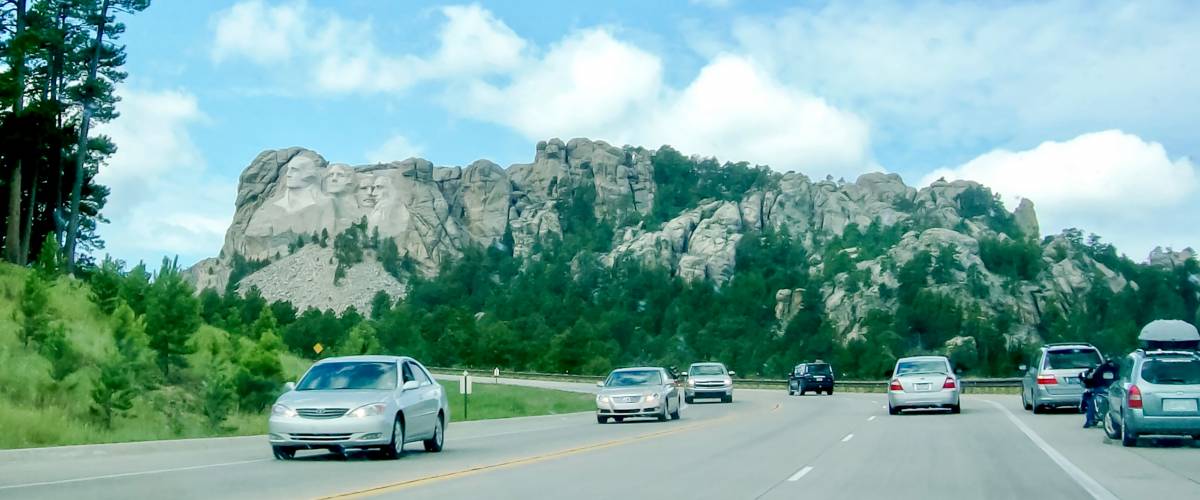 On the road with the view of Mount Rushmore National Memorial from the highway in South Dakota