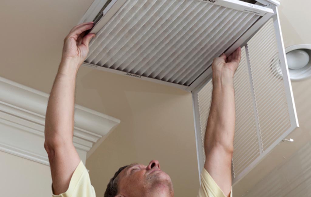 Man changing filter